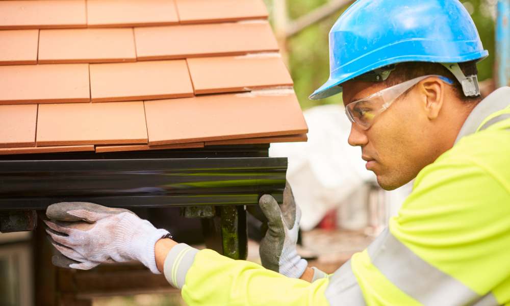 How do you attach gutters to concrete